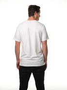 Male model facing away from camera wearing our white t-shirt