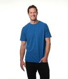 Male model smiling wearing our "azure" blue t-shirt