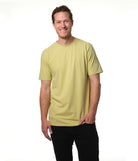 Male model smiling wearing our "light moss" green t-shirt