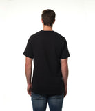 Male model facing away from camera wearing our premium black t-shirt