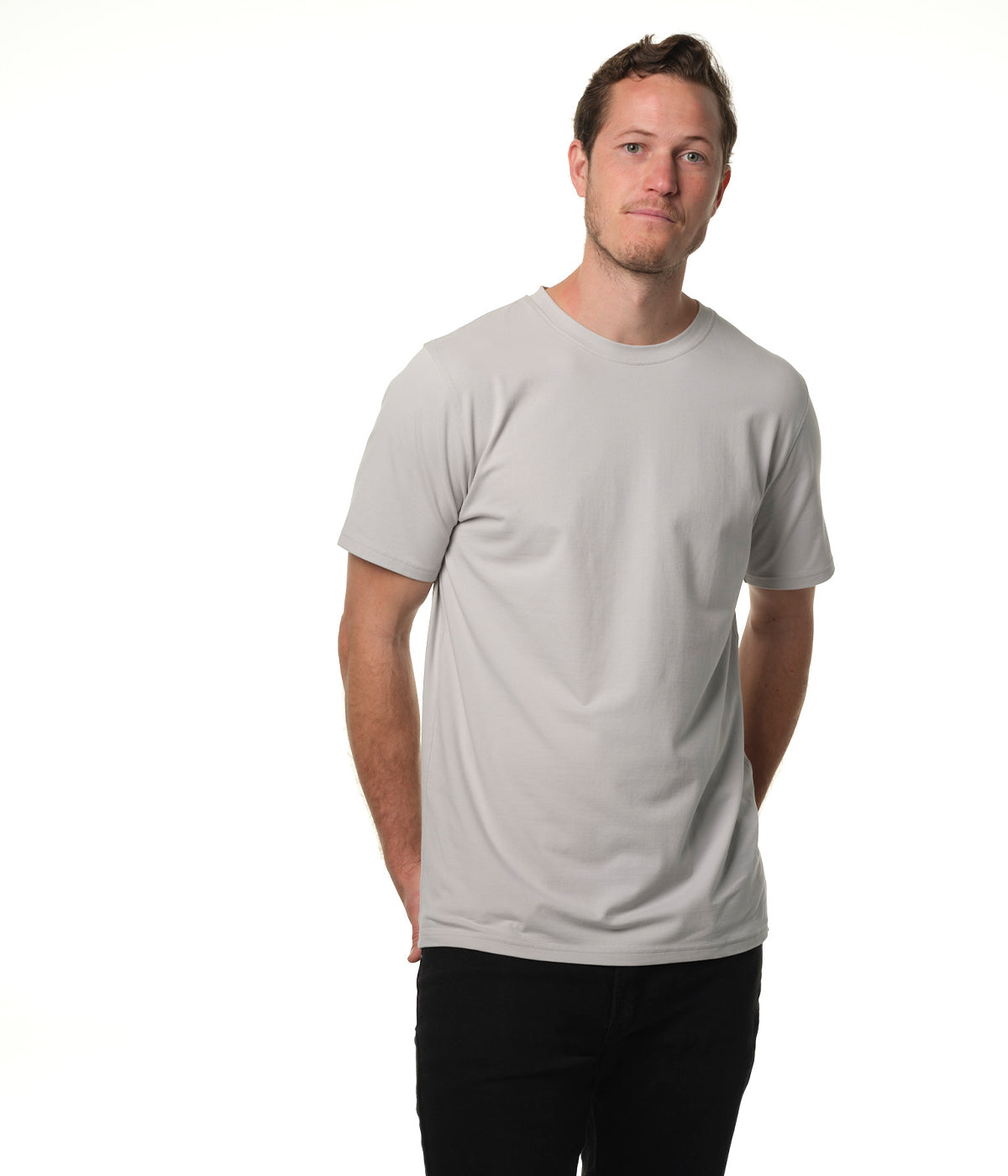 Video of male model entering screen from left wearing our "ash" gray premium t-shirt pausing center screen then exiting screen right