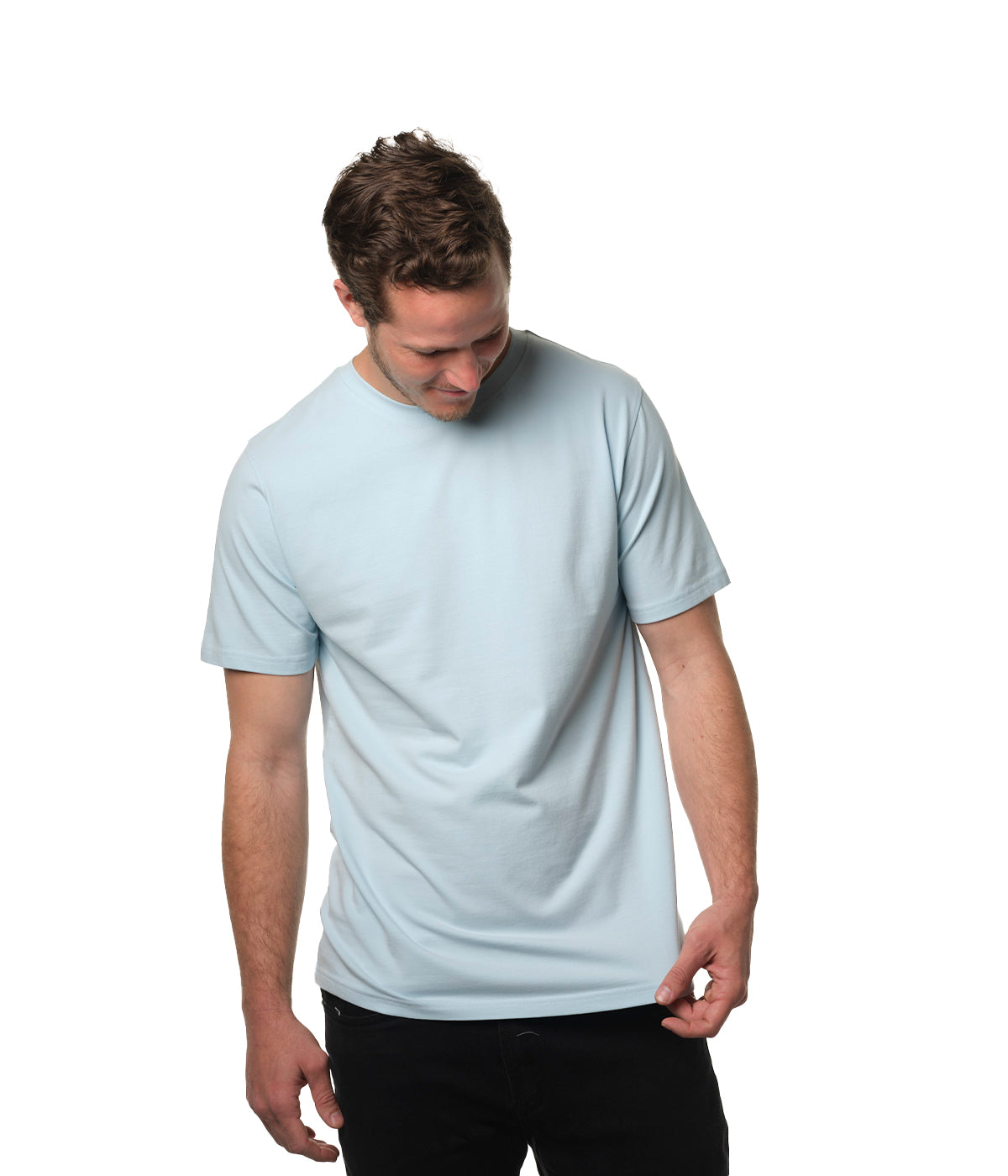 Video of male model entering screen from left wearing our "breakwater" light blue t-shirt smiling then exiting screen right