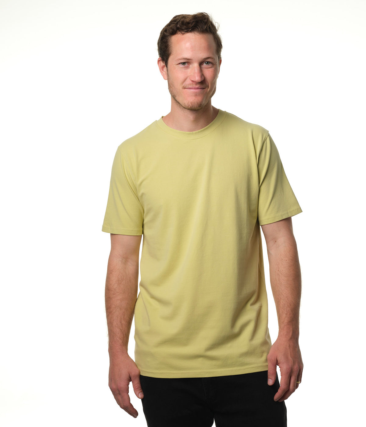 Video of male model entering screen from left wearing our "light moss" green t-shirt pausing center screen then exiting screen right