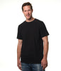 Video of model entering screen from left wearing our premium black t-shirt smiling at camera then exiting right